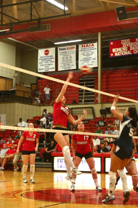 Junior Brisa Berlin blocks a hit by Lambuth University. - Photo by Stephanie Schroeder