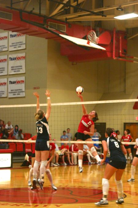 Junior Tiven Catrett hits the ball over the net past a Lambuth blocker. - Photo by Stephanie Schroeder