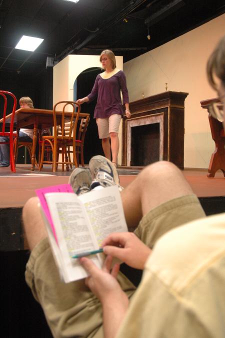 Junior Matt Stimmel sits off stage and follows along in his script as fellow Union students rehearse for <em>The Dining Room</em>. - Photo by Neisha Fuson