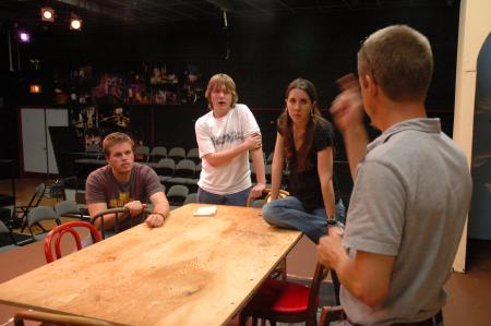 The cast of <em>The Dining Room</em> listens intently as the Director Chris Bennett provides some ideas for a scene.  - Photo by Neisha Fuson