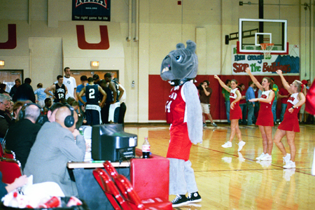 Buster and the cheerleaders pump up the crowd at Homecoming 2003.
 - Photo by Justin Veneman