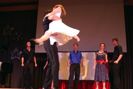 Alicia Stitch and Andrew Spena perform a dance number from <em>Dirty Dancing</em> for All-Sing during Family Weekend. Stitch and Spena participated with a large group led by Cody Curtis. - Photo by Stephanie Schroeder