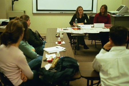 Journalists Kelli Ross and Julie Dodson share their experiences with journalism majors during the Communication Arts department's <i>Wisdom from the Trenches</i> during Homecoming 2003.
 - Photo by Justin Veneman