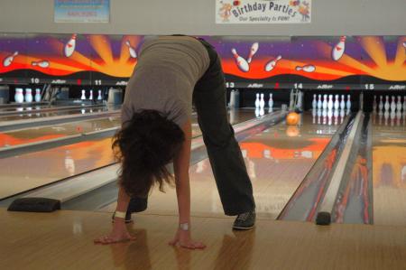 Strange techniques were used to knock down pins at the bowling night during Family Weekend.  - Photo by Neisha Fuson