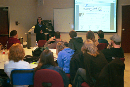 Lifeway internet producer Stephanie Lim talks with Digital Media Studies majors at the Communication Arts department's <i>Wisdom from the Trenches</i> at Homecoming 2003. - Photo by Justin Veneman