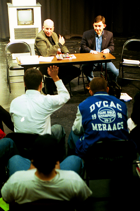 Blake Johnson (right) fields questions from broadcasting majors with assistant professor Steve Beverly at the Communication Arts department's <i>Wisdom from the Trenches</i> during Homecoming 2003. - Photo by Justin Veneman