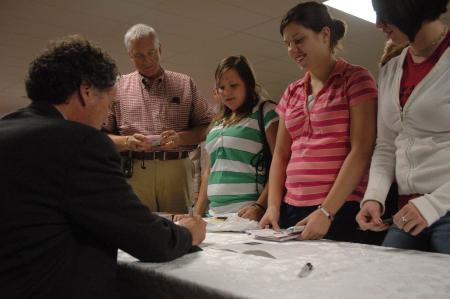 Dr. Edward L. Ayers signed books after his address on the Civil War at the Carls-Schwerdfeger History Lecture Series.  - Photo by Neisha Fuson