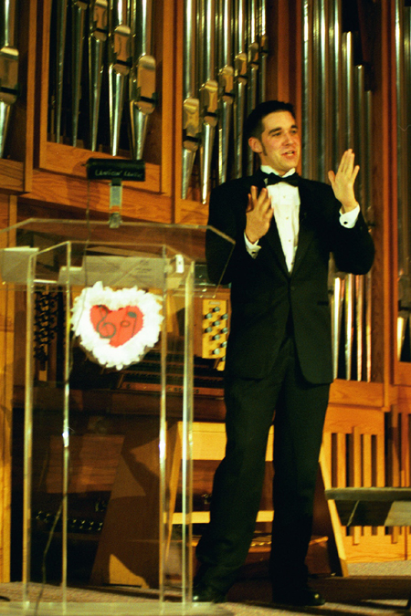 Sophomore Brennan Uthe was this year's emcee at All-Sing during Homecoming 2003. - Photo by Lindsay Stavish