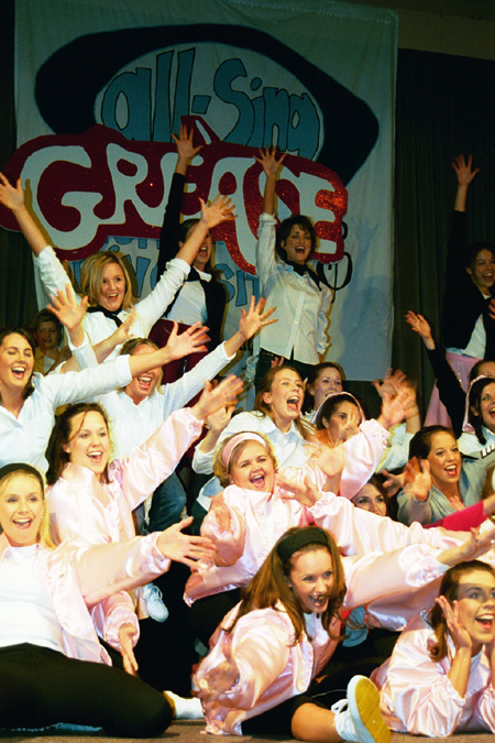Chi Omega hits their last note during their performance of a number from <i>Grease</i> at All-Sing during Homecoming 2003. - Photo by Lindsay Stavish