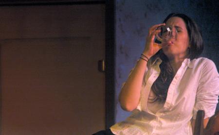 Catherine Schulz performs in <em>The Dining Room</em>.  - Photo by Matthew Diggs