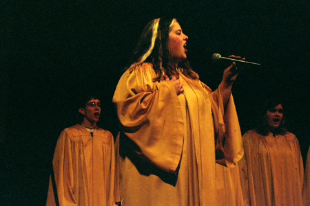 SAC member Melissa Gruver takes the lead at All-Sing during Homecoming 2003. - Photo by Lindsay Stavish