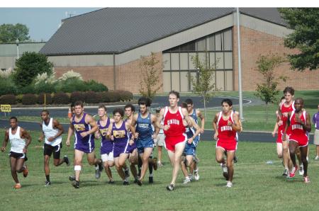 Douglas Martin (front middle) leads the pack at the start of the Union Cross Country Invitational.  Union captured the title in both the men's and women's race. - Photo by Tommy Sadler