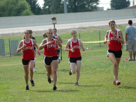 Lydia Bond leads the Union team during the Union Cross Country Invitational.  Bond won the individual title and helped Union to the team title. - Photo by Tommy Sadler