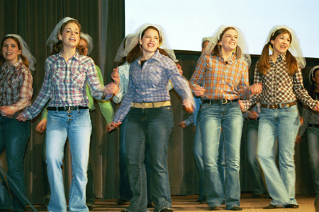 Zeta brides perform Shania Twain's &ldquo;Don't Be Stupid (You Know I Love You)&rdquo; at All-Sing during Homecoming 2003. - Photo by Lindsay Stavish
