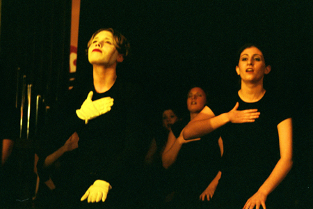 Zeta Tau Alpha ladies mime at All-Sing during Homecoming 2003. - Photo by Lindsay Stavish