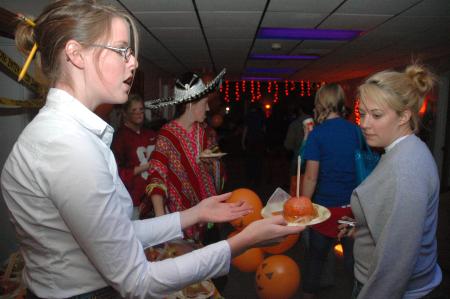 The Costume Coffee House was held in Hurt Commons where RA's served students caramel apples, as well as many other goodies.  - Photo by Neisha Fuson