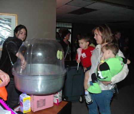 Residence Director Ashley Jackson and her boys enjoyed the cotton candy at the Costume Coffee House. 
 - Photo by Neisha Fuson