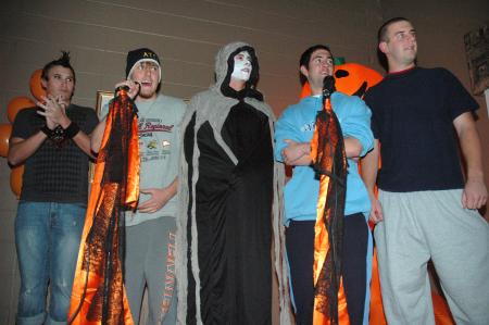 Karaoke was another fun attraction at this year's Costume Coffee House. These guys were brave enough to stand in front of the tough crowd of princesses, fairy tale characters and hippies. - Photo by Neisha Fuson