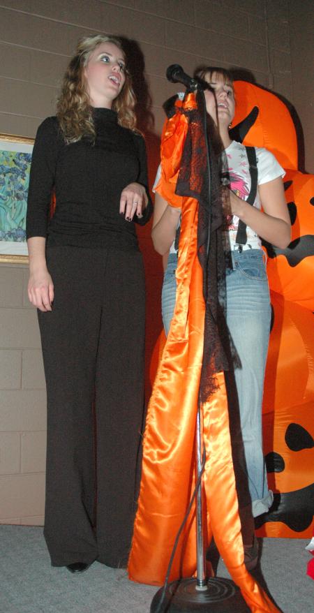 Elizabeth Wood and Lindsey Sparks sang karaoke at this year's Costume Coffee House.  - Photo by Neisha Fuson