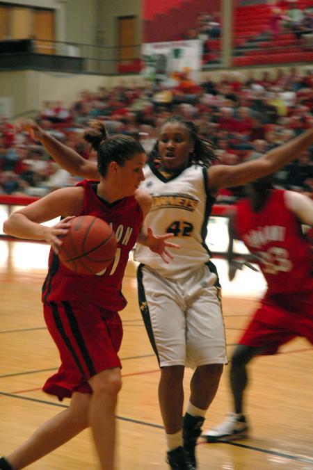 Junior Merideth Richardson Jacobs drives past defenders in Union's win over Harris-Stowe State College (Mo.).  - Photo by Neisha Fuson