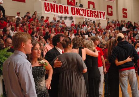 Union students visit, laugh and chat while waiting for the Homecoming game to begin again.  - Photo by Neisha Fuson