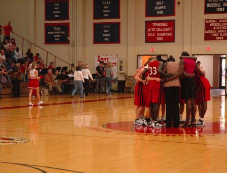 The Lady Bulldogs officially end the game with a team prayer in the center of the court.  - Photo by Neisha Fuson