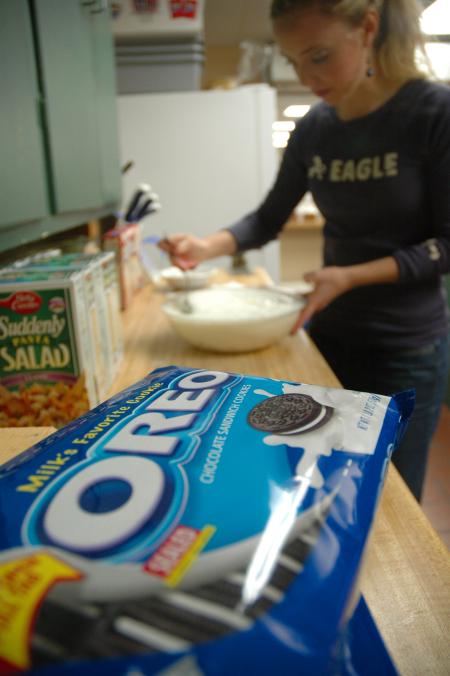 Sophomore Elizabeth Wood mixes angel food cake ingredients for a J-Crib banquet. Wood co-lead this Day of Remembrance project at J-Crib.  - Photo by Neisha Fuson