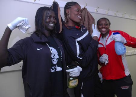 Members of the Lady Bulldog basketball team play around in front of the camera in between their cleaning duties at J-Crib Ministries during Day of Remembrance.  - Photo by Neisha Fuson