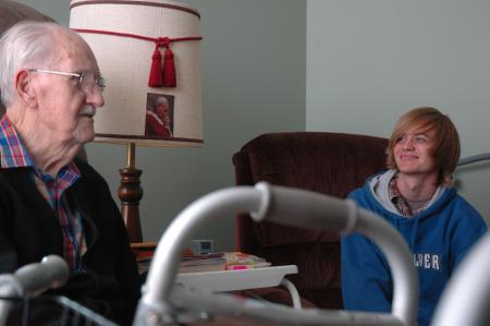 A resident of Cheyenne Trace, George, told Freshman Benjamin Ferrell all about his life, family, and past during Day of Remembrance.  - Photo by Neisha Fuson