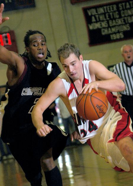 Union junior Matt Neaville drives around a defender in the Bulldogs' Homecoming win over Campbellsville University (Ky.).  - Photo by Matthew Diggs