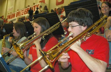 Band Members Stephanie Anderson, Katelyn Saylor and Bob Sparks liven up the Homecoming game. - Photo by Matthew Diggs