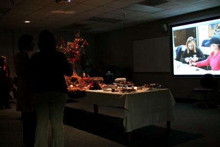 Attendees of the School of Nursing's homecoming reception are shown a video and treated to a wonderful array of desserts. - Photo by Kristi McMurry Woody