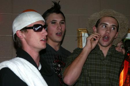 Freshmen Ryan Hoover, Micah Roeder and Brad Boswell sing karaoke during the Costume Coffee House. - Photo by Stephanie Schroeder