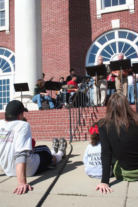 Blake Ward of Jackson and his family enjoyed watching the reunion band play in front of Jennings Hall during Homecoming's Arts in the Park. - Photo by Kristi McMurry Woody
