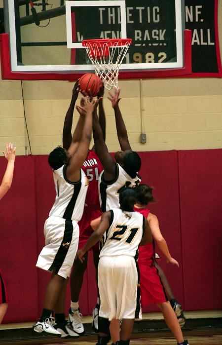 Union junior Josephine Owino fights for a rebound. - Photo by Kristi McMurry Woody