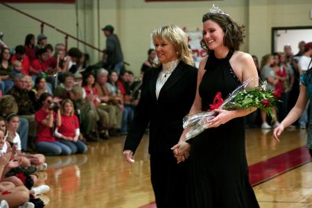 Senior Homecoming Quessn Kirby Maxwell smiles as she goes to sit with her court for the remainder of the Homecoming ballgame. - Photo by Kristi McMurry Woody