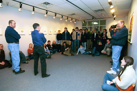 Artist Roger Sullivan speaks to a full house at his artist's recpetion. - Photo by Jim Veneman