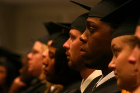 Mack Bealim and other fall graduates focus at the commencement ceremony. - Photo by Stephanie Schroeder