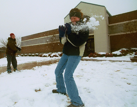 Jonathan Yorkowitz nails Sarah Bradley with a snowball during recent wintery weather. - Photo by Justin Veneman