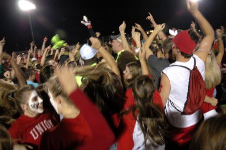 A thrilled crowd of Union students, faces painted red and white and hands raised high, floods the soccer field and surrounds the Bulldog footballers as the final whistle is blown, celebrating 
a stunning 3-1 victory over cross-town rival Lambuth University.  - Photo by Matt Elia