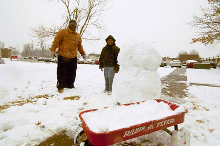 A rare snow day brings out the child in us all. - Photo by Justin Veneman