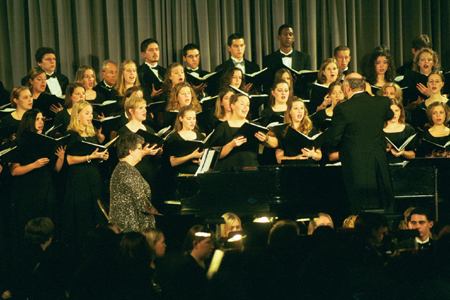 Dr. Richard Joiner leads the combined choir during <i>A Union Christmas</i>. - Photo by Jim Veneman