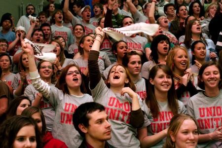 Jill Casey and Kinsey Bolinger cheer on the Lady Bulldogs Basketball team as they play against Freed Hardeman University in the first home game since the tornado. - Photo by Kyle Kurlick