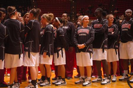 The Lady Bulldogs stand on the court to help form the letters NAIA for this year's tournament.  - Photo by Neisha Fuson