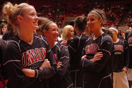 Lady Bulldogs laugh and chat before the first game of this year's NAIA tournament.  - Photo by Neisha Fuson