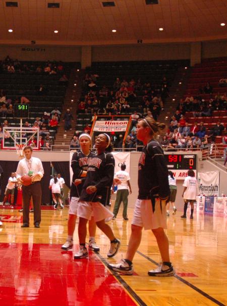 Junior Jessica Graves, center, laughs during practice before the first game of this year's NAIA.  - Photo by Neisha Fuson