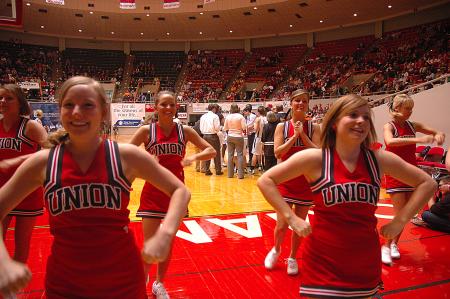 The Bulldog Cheerleaders keep the atmosphere positive during the first game at the NAIA.  - Photo by Neisha Fuson