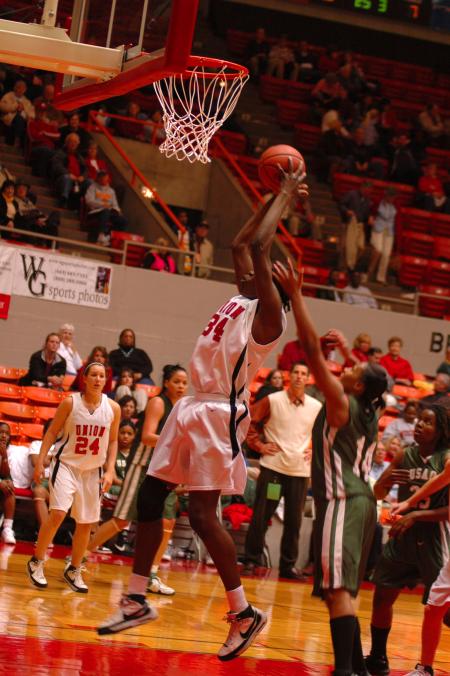 Freshman Beatrice Awino leaps to score for the Lady Bulldogs during the first game of this year's NAIA.  - Photo by Neisha Fuson