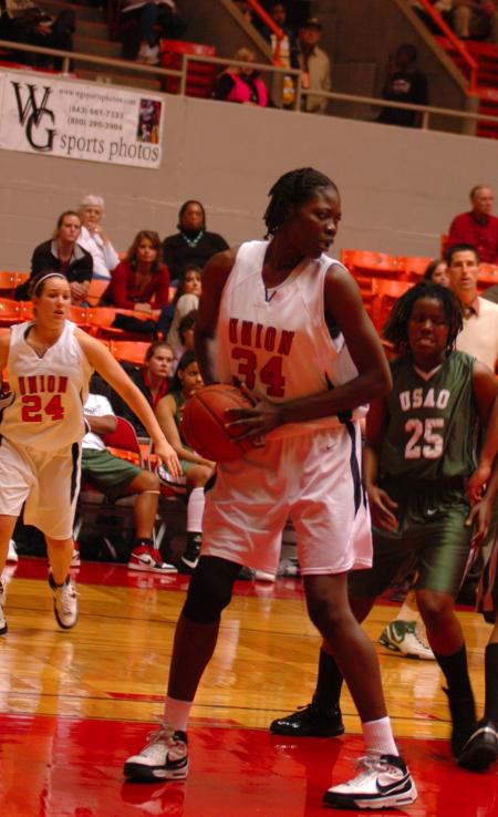 Freshman Beatrice Awino locks her feet in position and looks before she takes the next step in the first game of this year's NAIA.  - Photo by Neisha Fuson