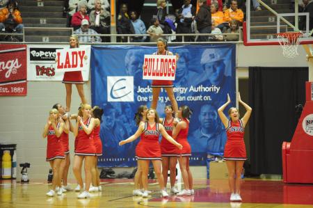 The cheerleaders lead the crowd in a cheer during the NAIA national tournament. - Photo by Morris Abernathy